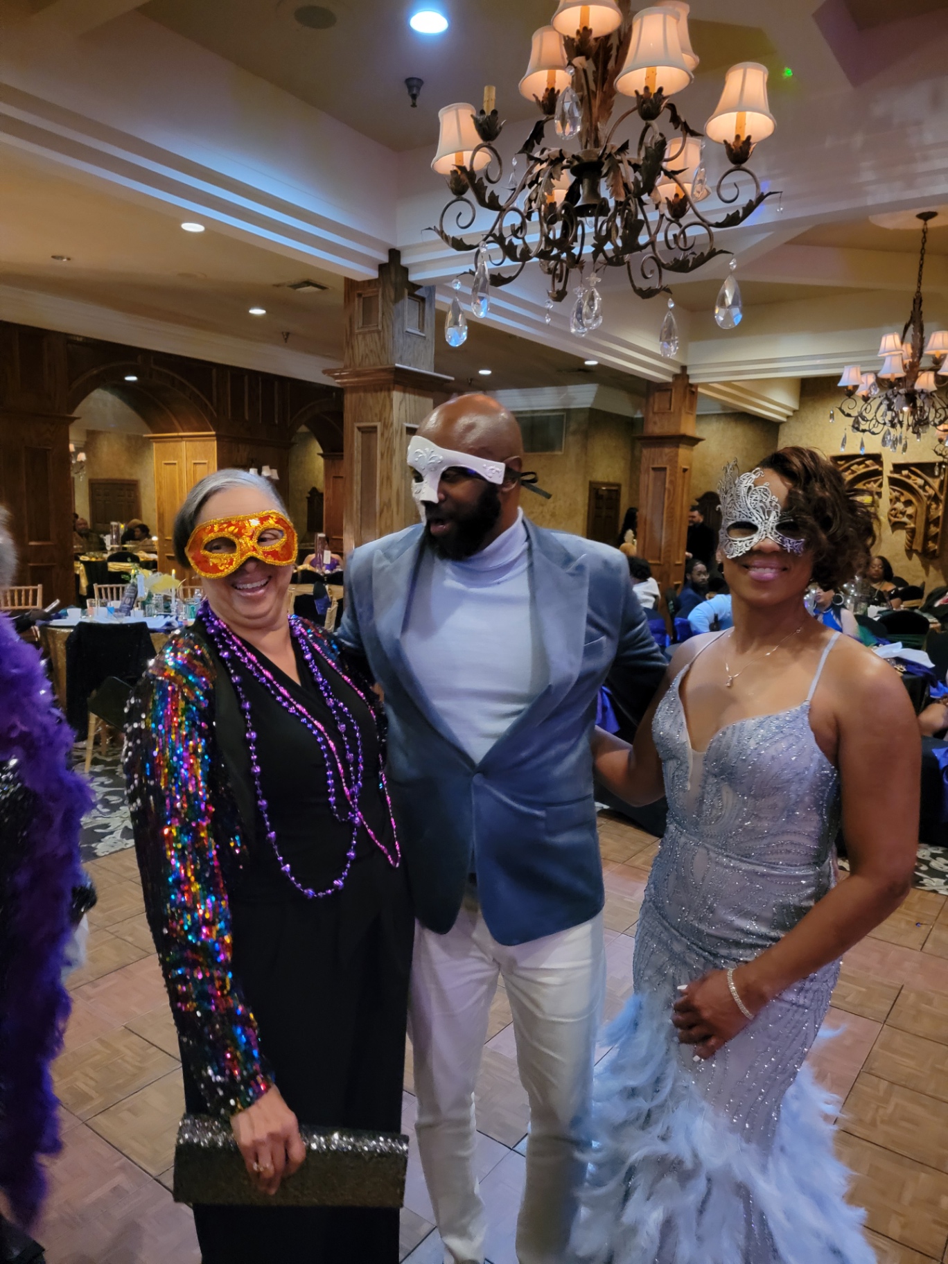Guests in masquerade masks